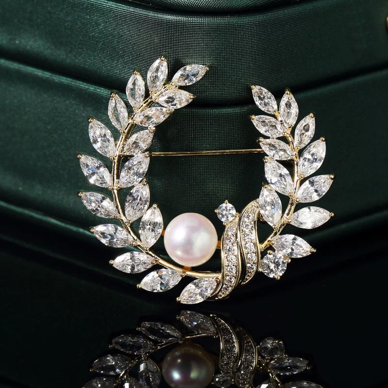 Golden pearl brooch pins