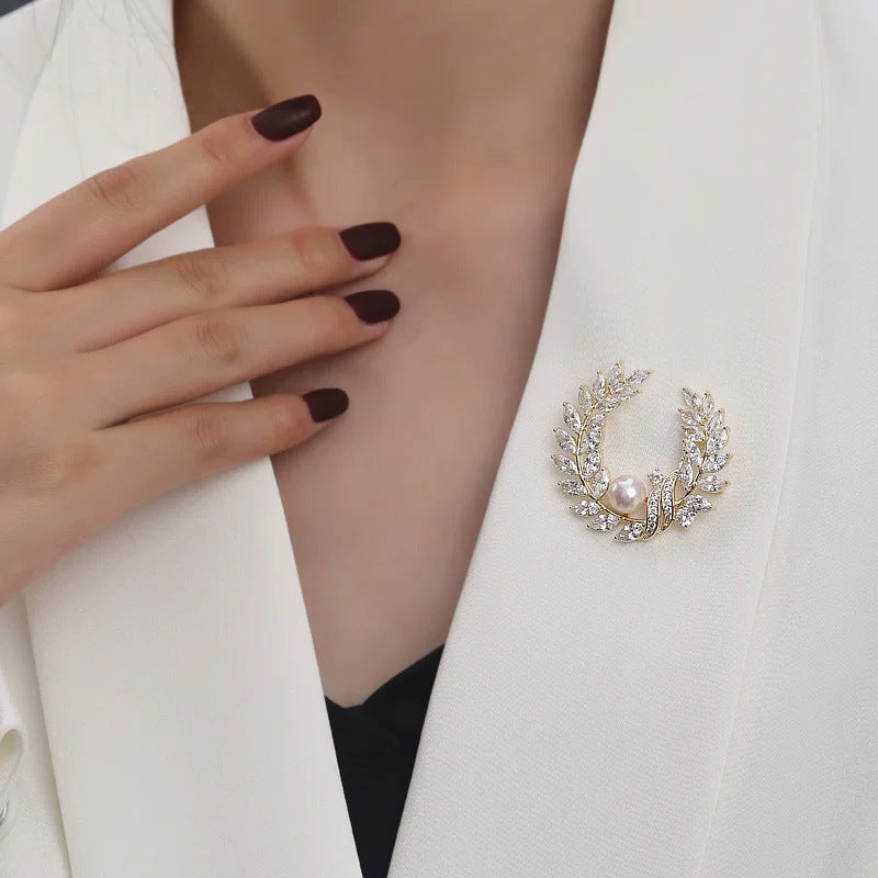 Golden pearl brooch pins