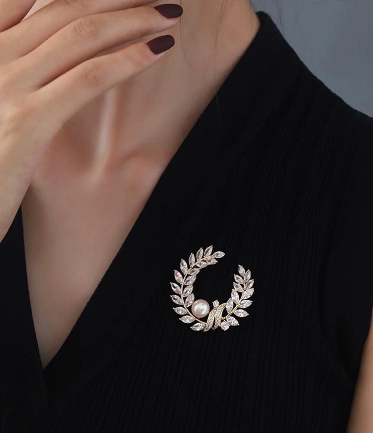 Golden pearl brooch pins