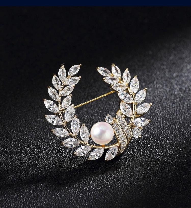 Golden pearl brooch pins